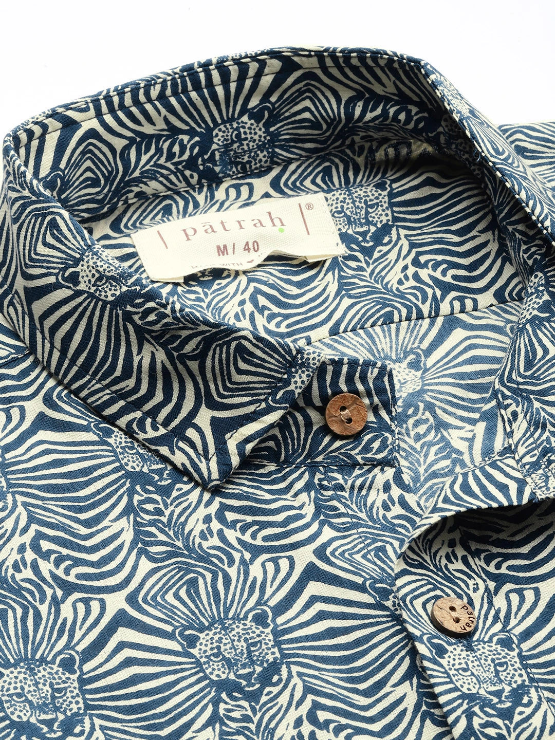 Close-up of a printed shirt with patrah brand label 