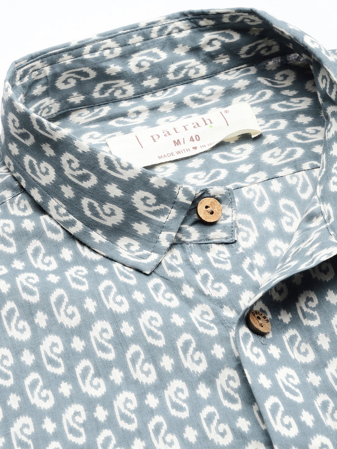 Blue and white print shirt with patrah label. 