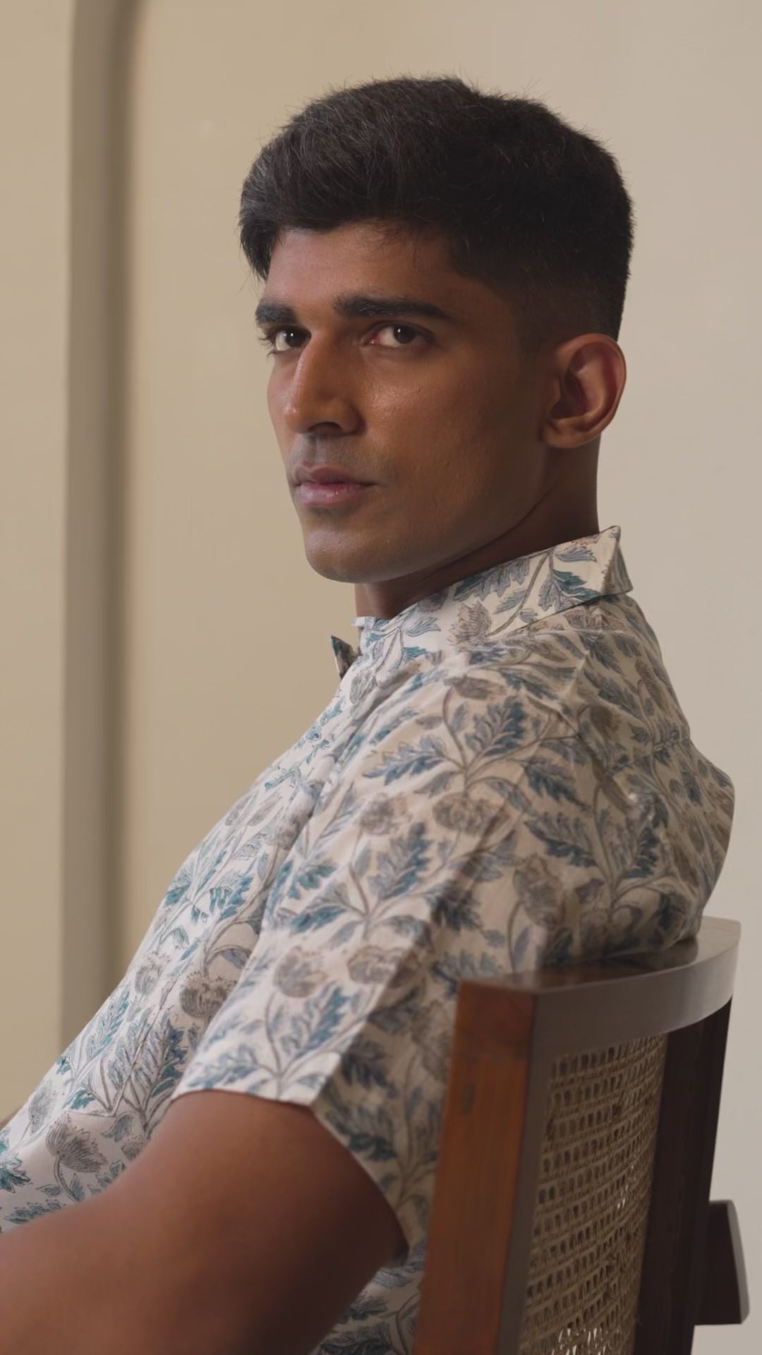 Model presenting men’s casual shirt from multiple angles