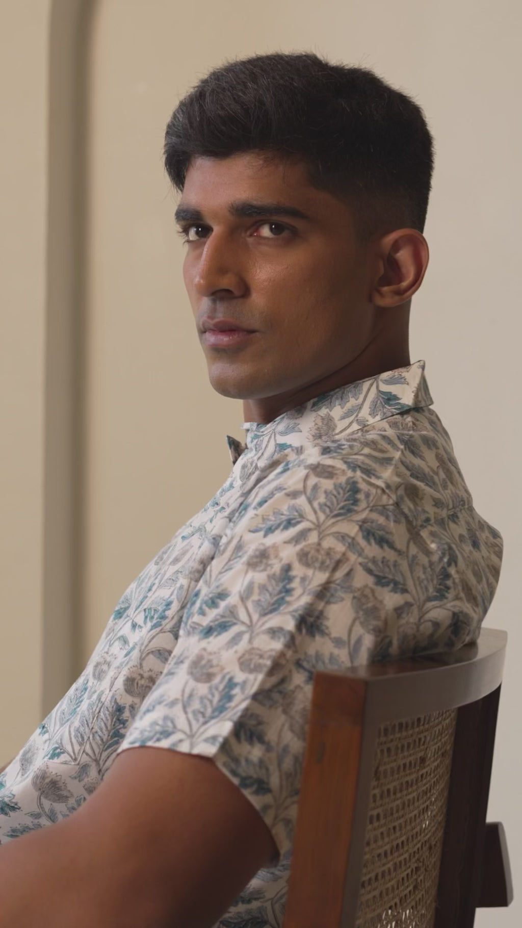 Model presenting men’s casual shirt from multiple angles