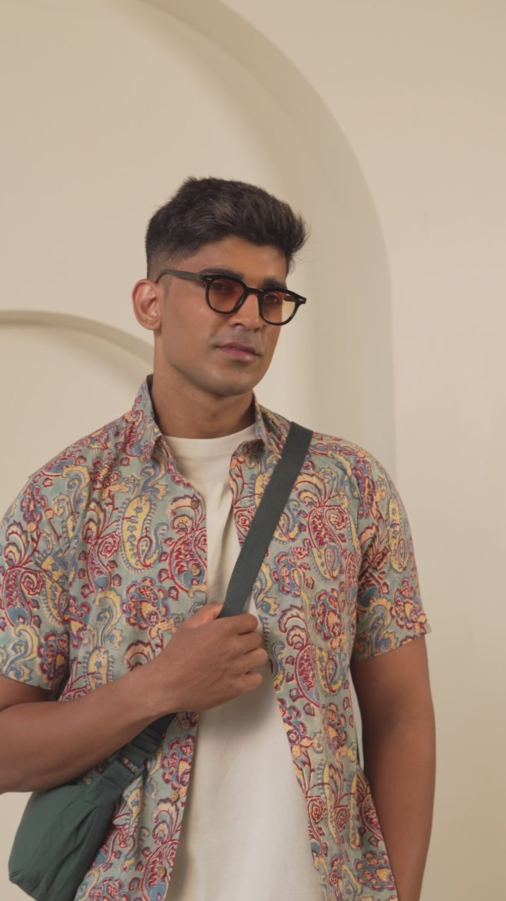 Model wearing men’s casual  shirt highlighting fabric quality and stitching